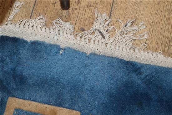 A Chinese blue ground carpet with Greek key border 480 x 365cm